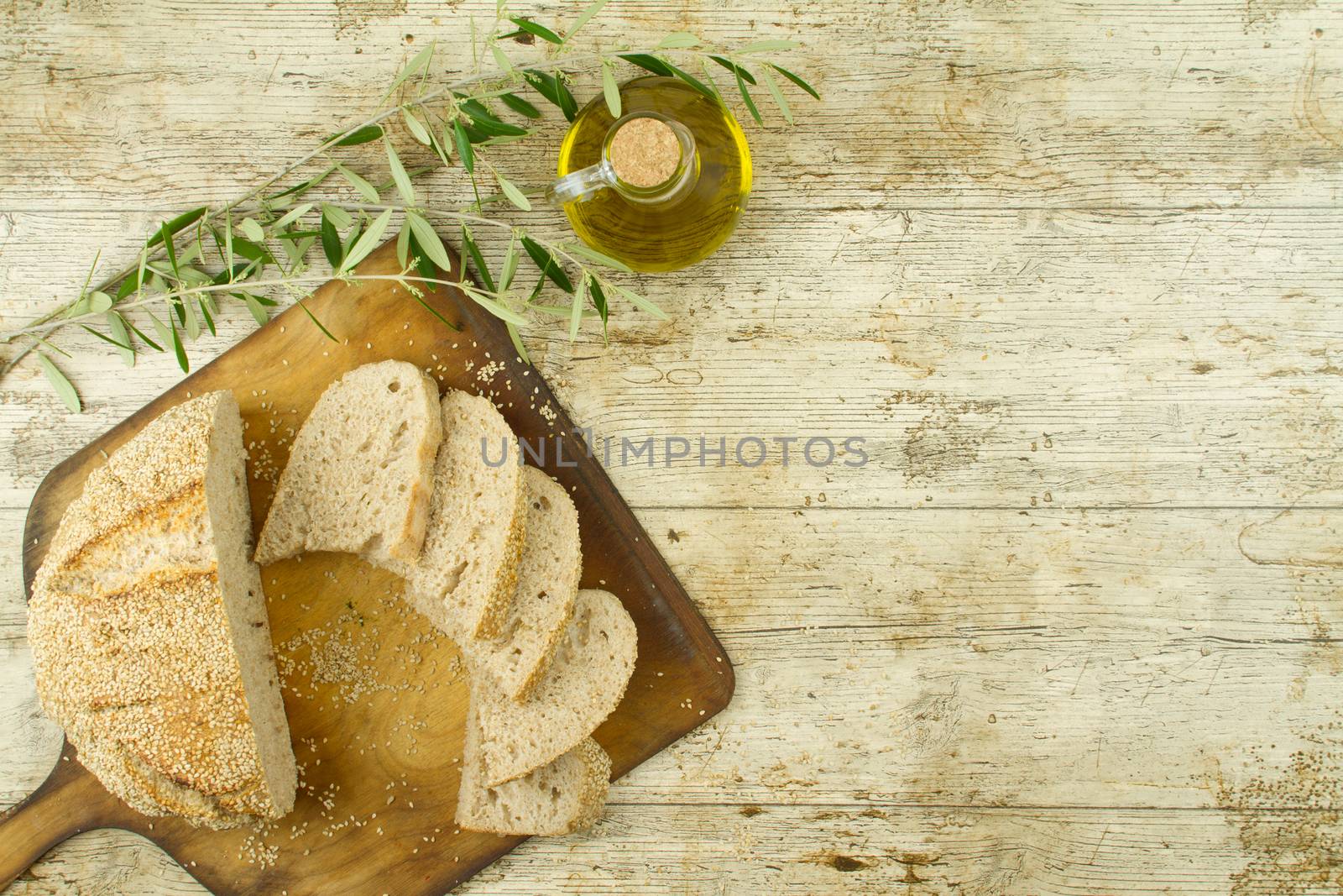 Close-up of a sliced loaf of homemade bread with sesame seeds, a by robbyfontanesi