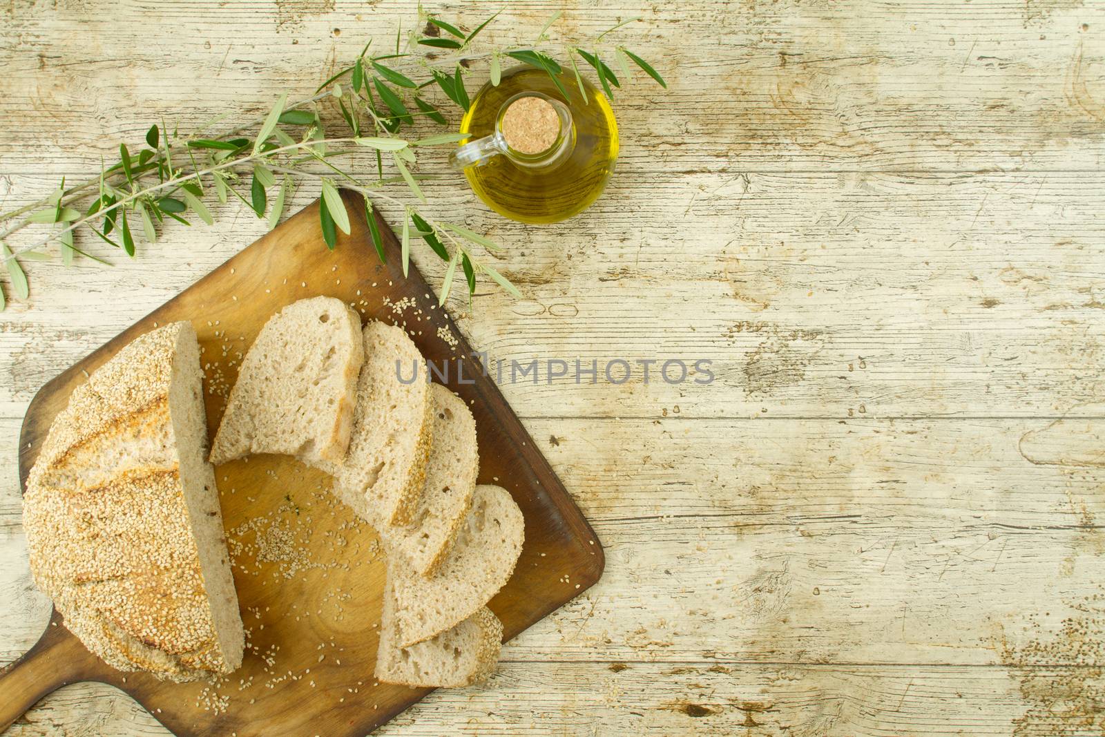 Close-up of a sliced loaf of homemade bread with sesame seeds, a by robbyfontanesi