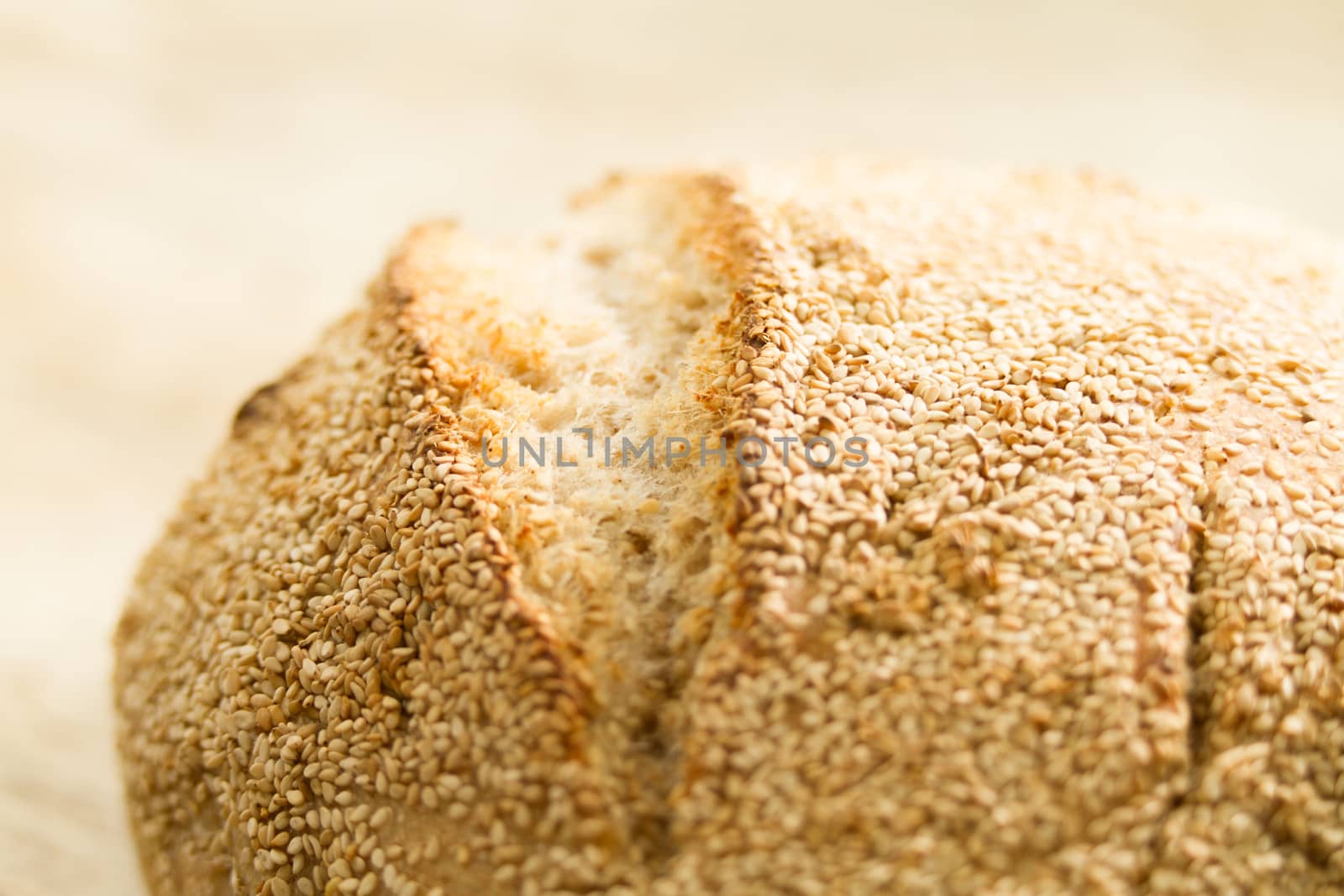 Closeup of a loaf of homemade bread with sesame seeds in selecti