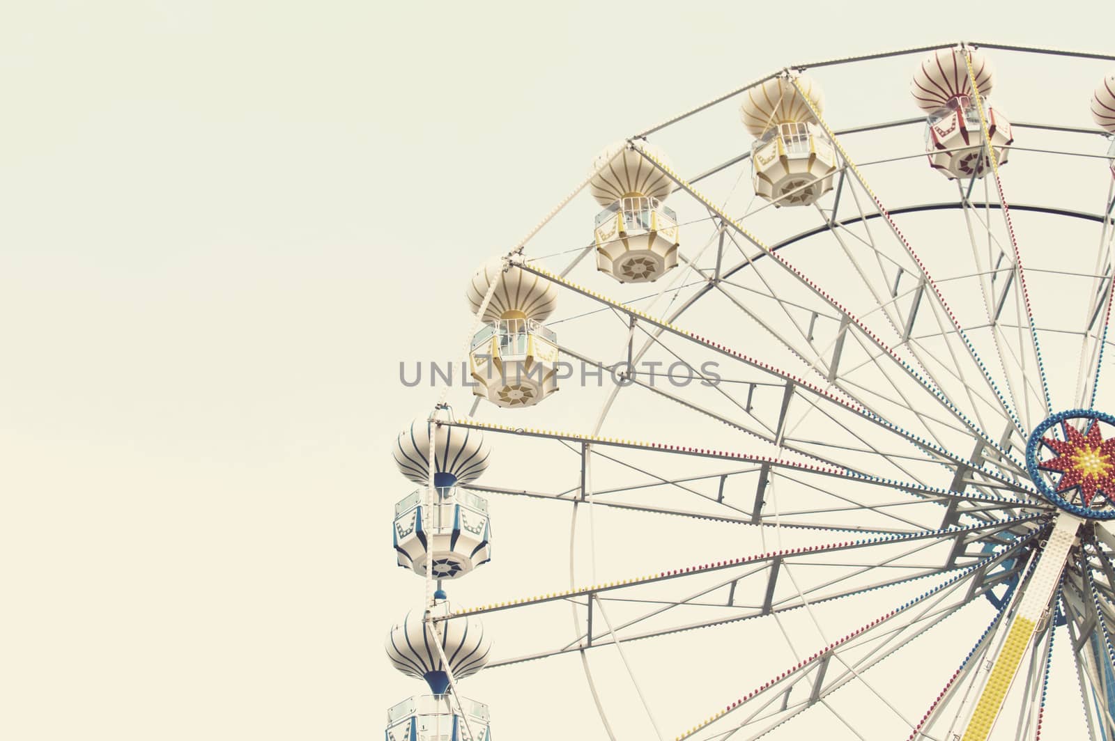 ferris wheel against blue sky, vintage filter effects