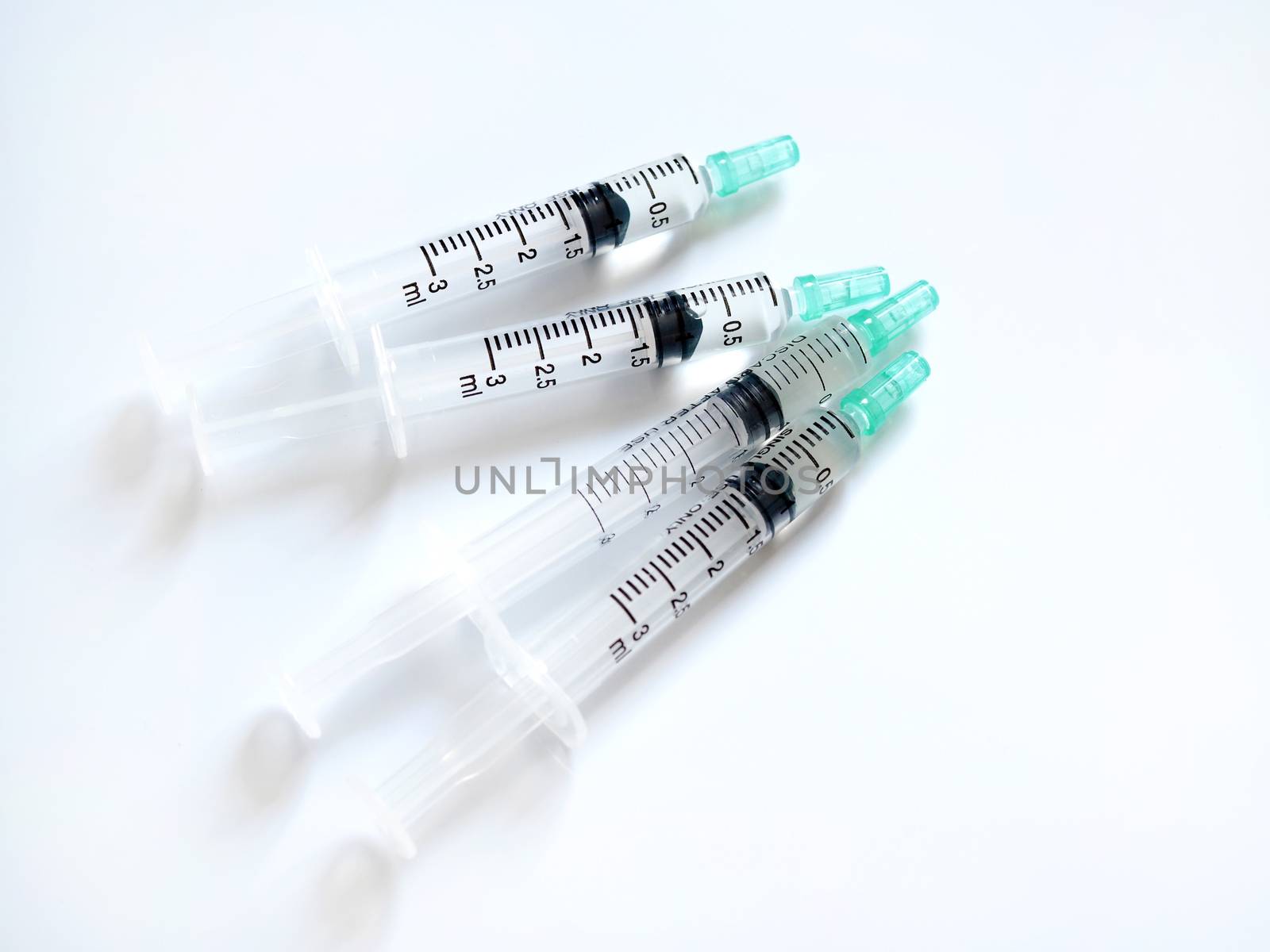 Syringe with liquid medicine isolated on white background. by kittima05