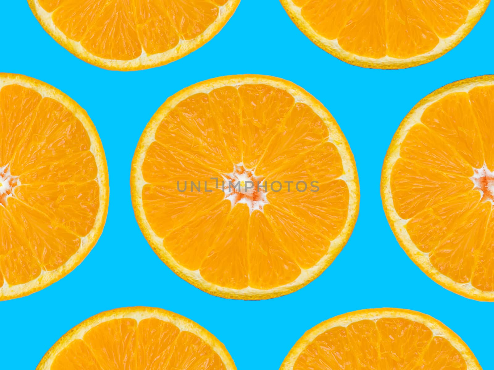 Orange slices pattern on blue background, pop art style