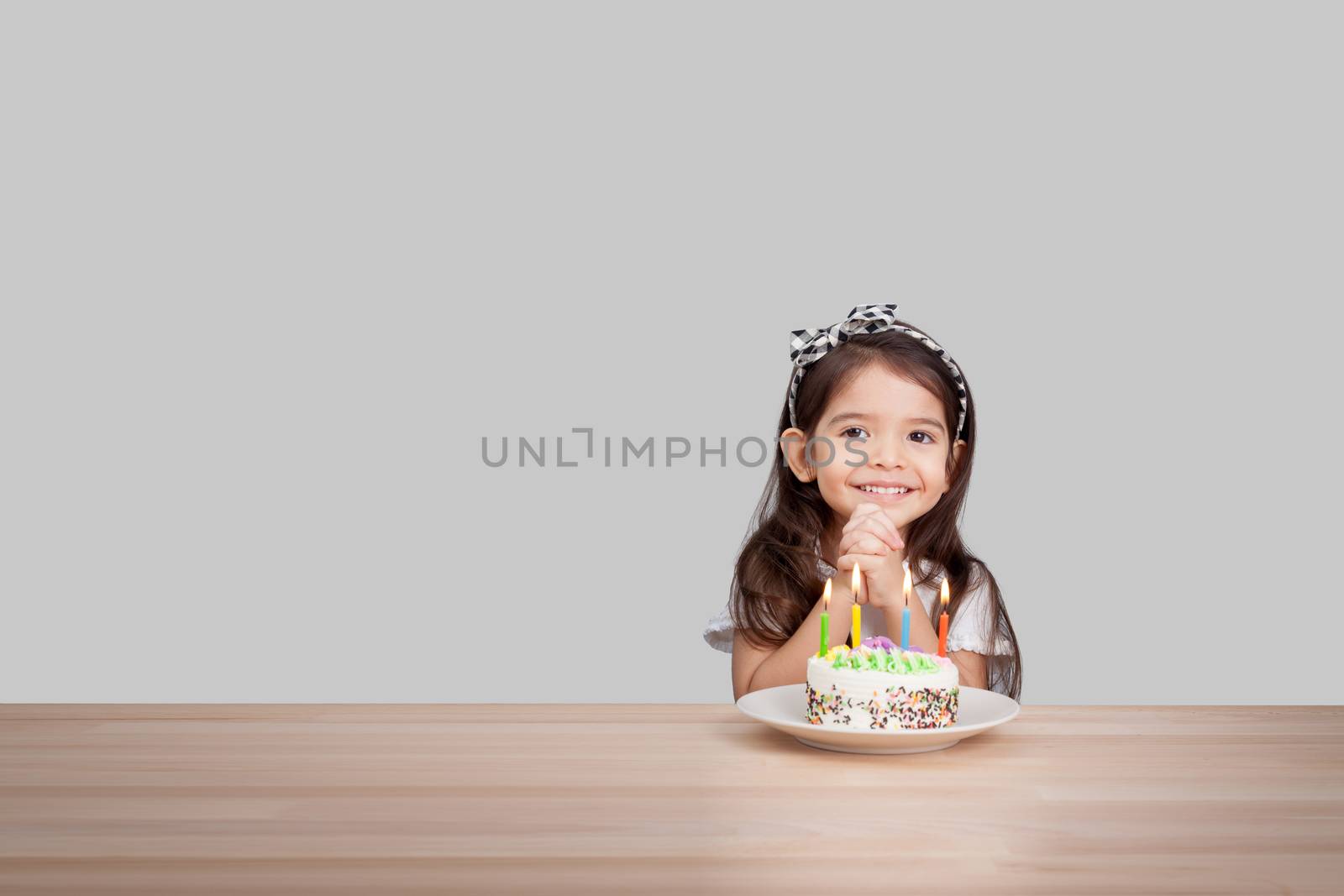 cute girl make a wish on birthday. Happy Birthday background. Greeting background for card, flyer, poster, sign, banner, web, postcard, invitation. Abstract fest background for text, type, quote