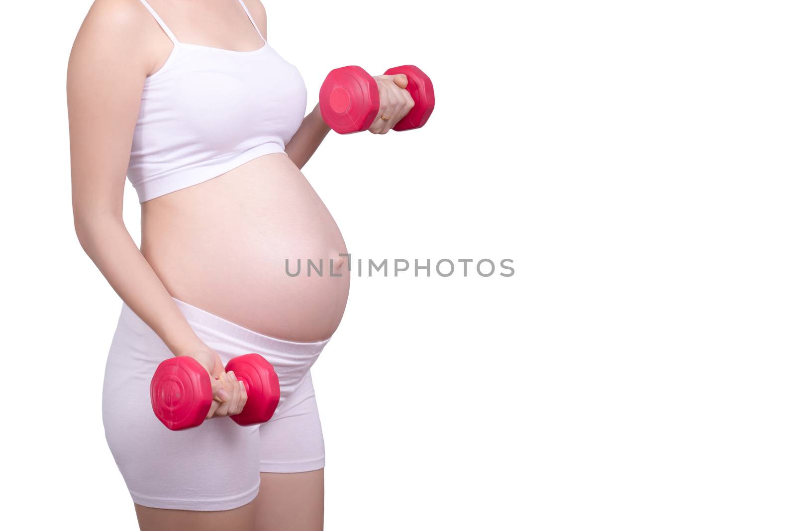Pregnant exercises concept.A portrait of a Beautiful asian pregnant woman doing light exercise by using dumbbell  isolated on white background with clipping path. Anonymous face Asia female in her 20s by asiandelight