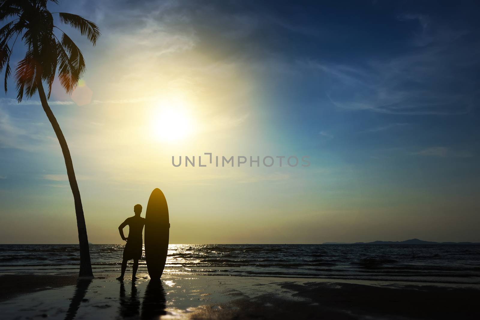 Silhouette of surf man stand with a surfboard and coconut palm. Surfing at sunset beach. Outdoor water sport adventure lifestyle.Summer activity. Handsome Asia male model in his 20s. by asiandelight