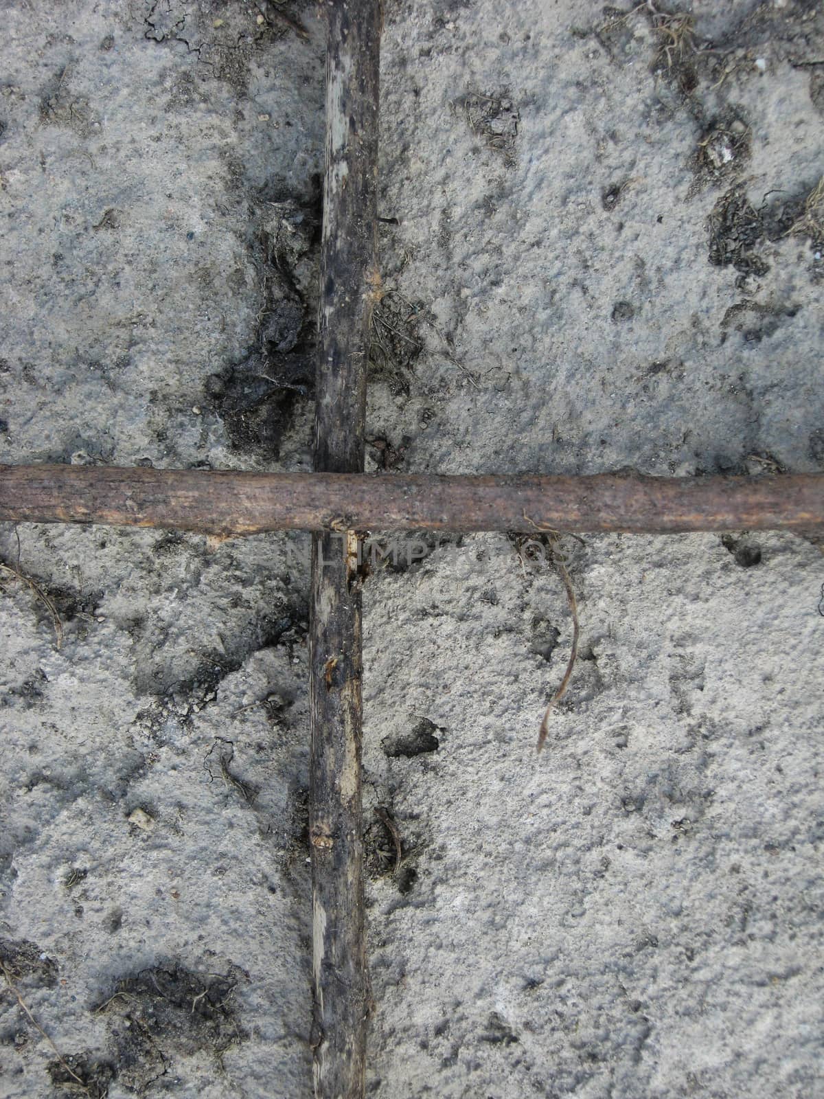 Cross on the wall made from stone