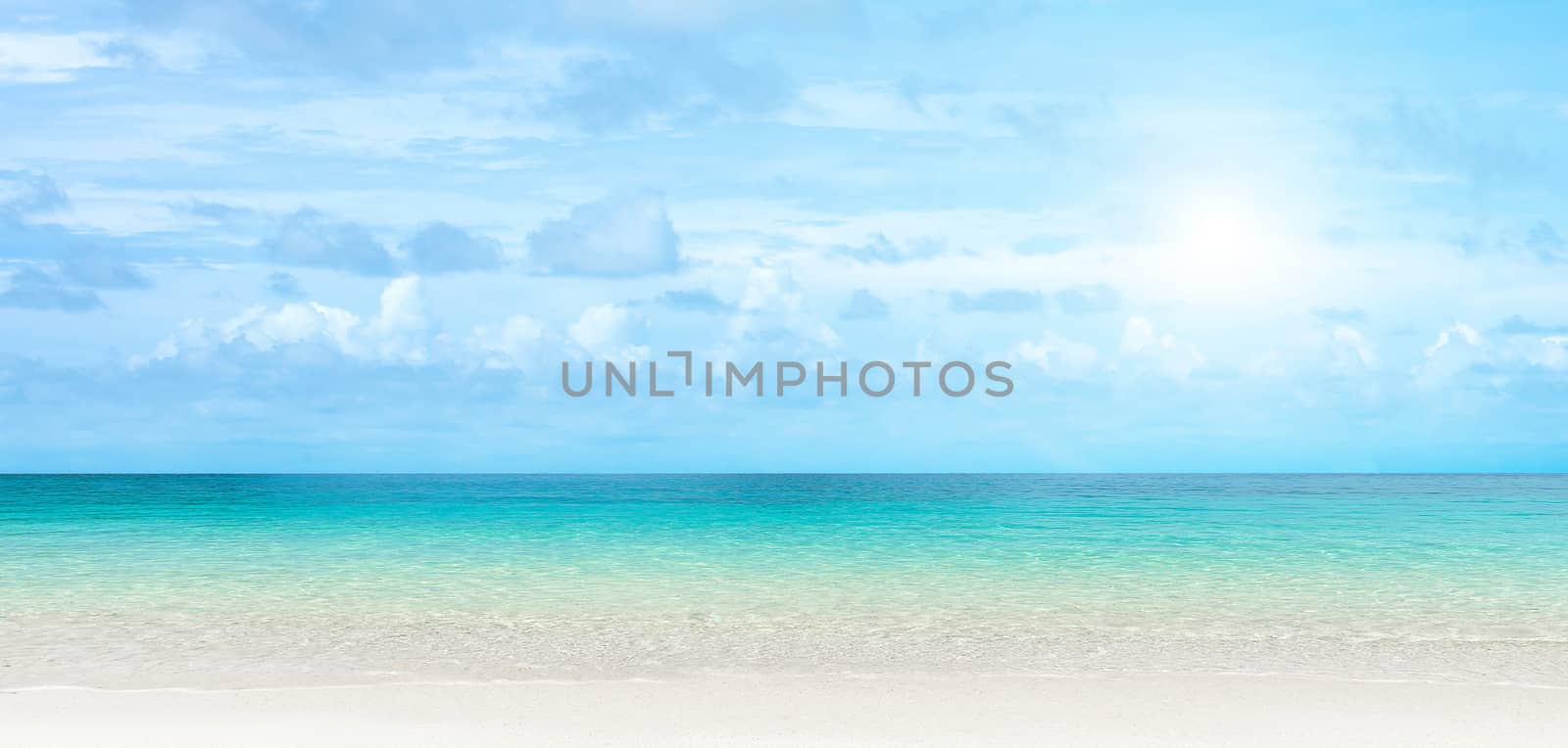 Panorama view of Transparent blue sea water background in Tropical summer beach, summer background.