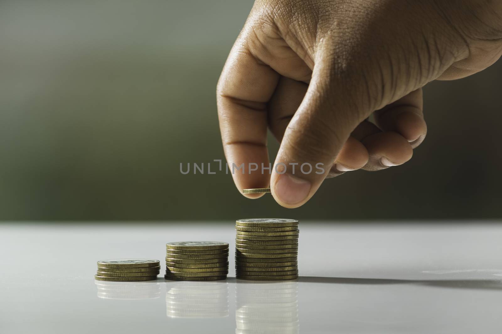 Hand drop a coin with money coin stack growing for business. fin by kirisa99