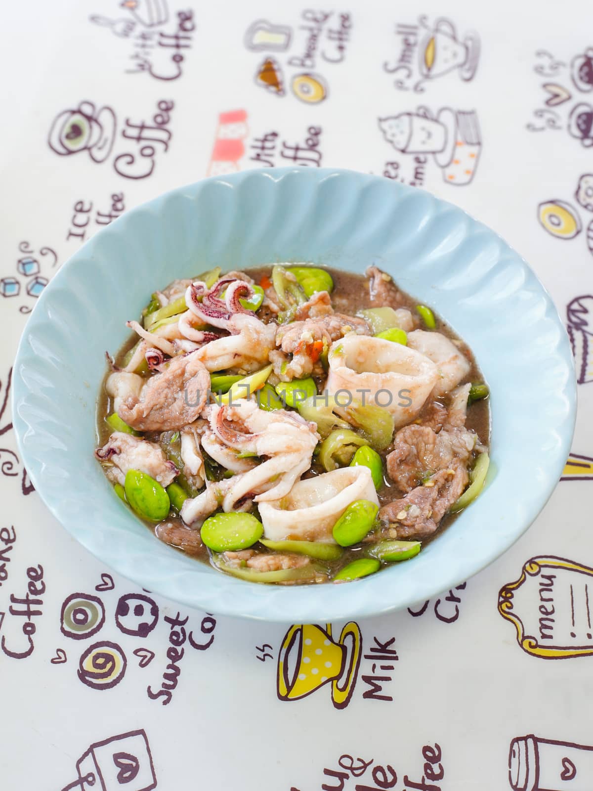 Closed up shot of Southern Thai cuisine Stir fried stink bean with pork and squid.