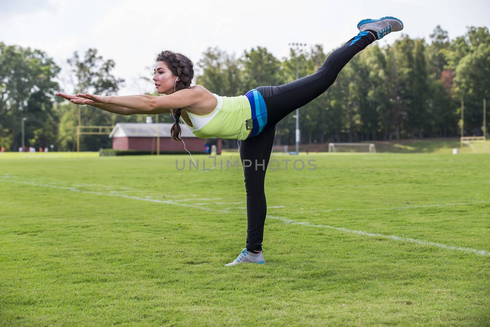 A gorgeous blonde fitness model working out in an outdoor environment
