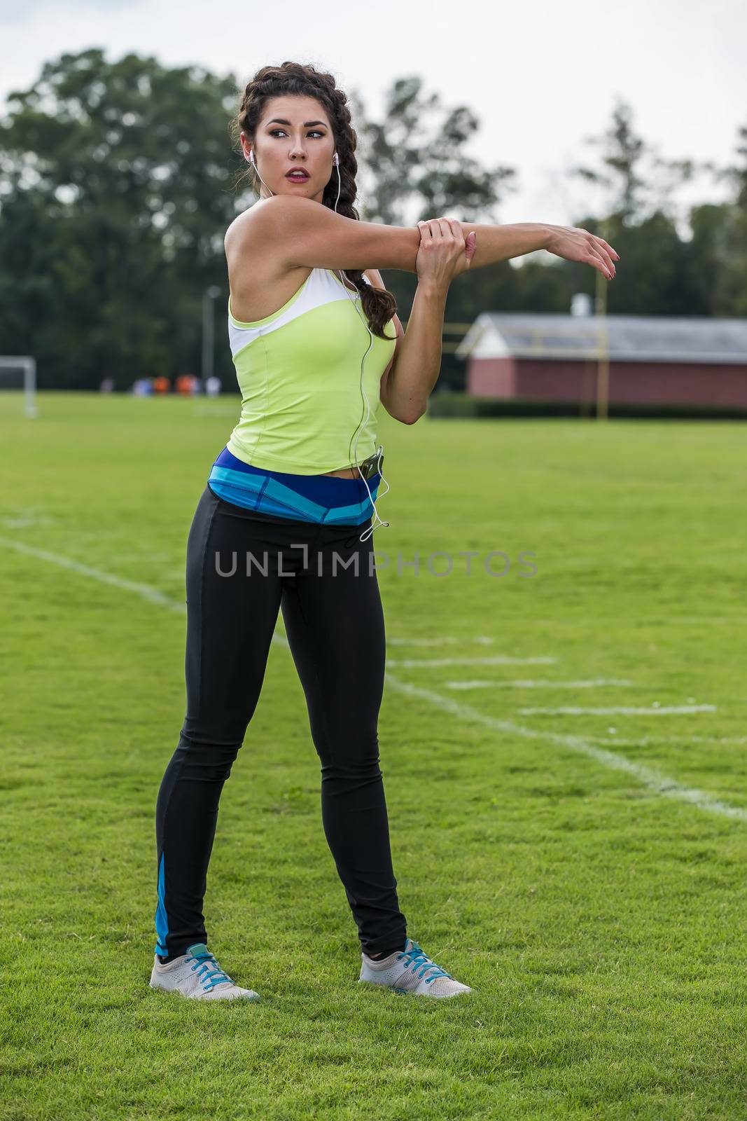 A gorgeous blonde fitness model working out in an outdoor environment