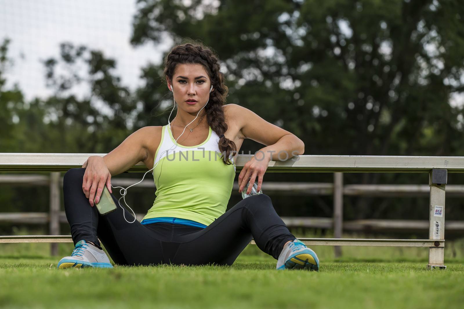 A gorgeous blonde fitness model working out in an outdoor environment