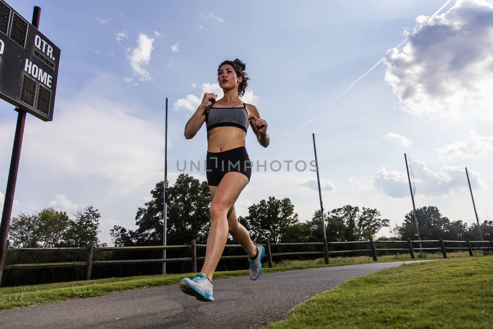 A gorgeous blonde fitness model working out in an outdoor environment