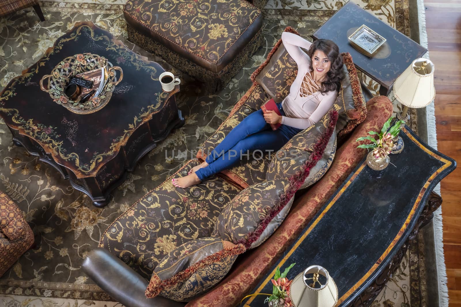 A gorgeous brunette model enjoys a day at home before work