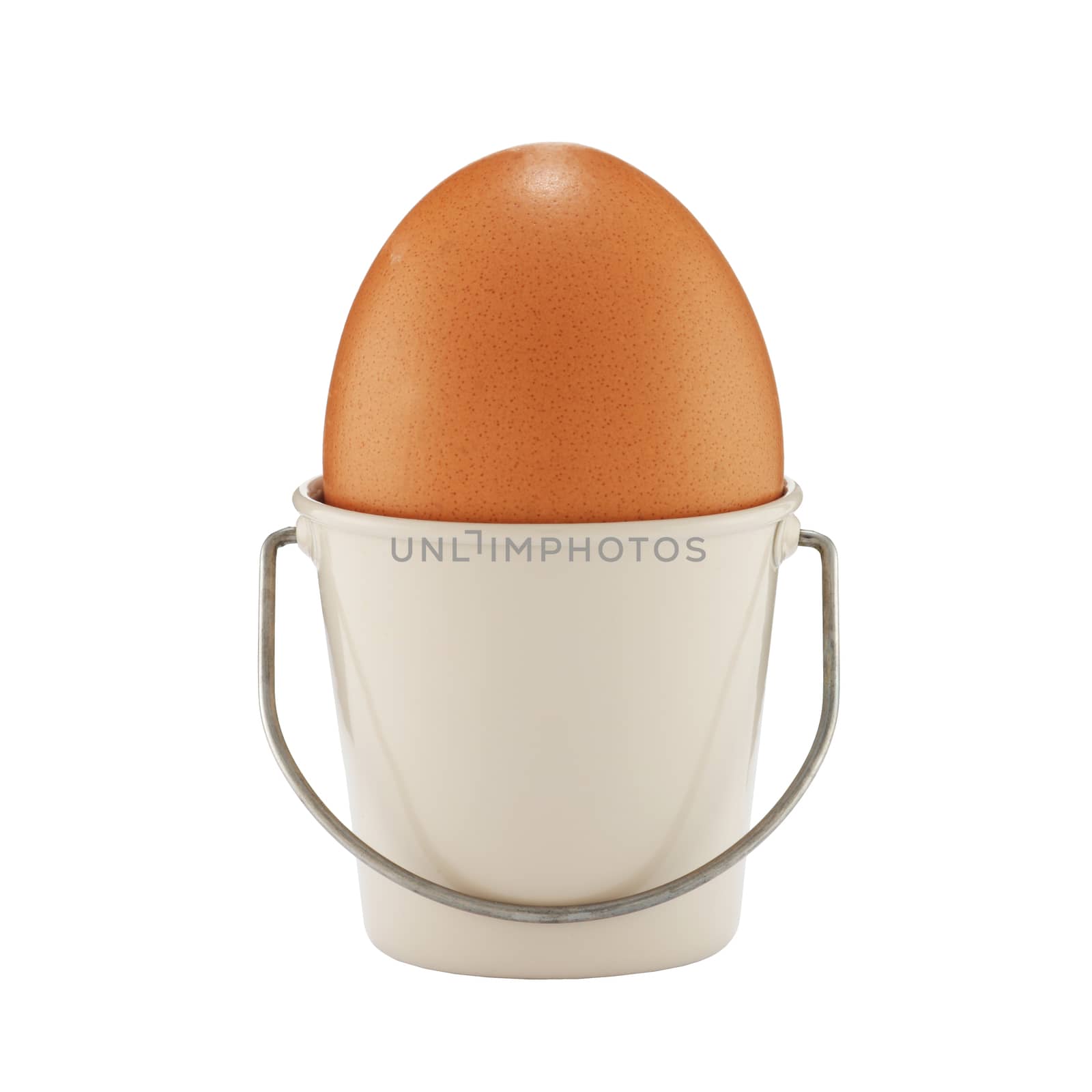 An egg in a bucket shaped eggcup on white with clipping path