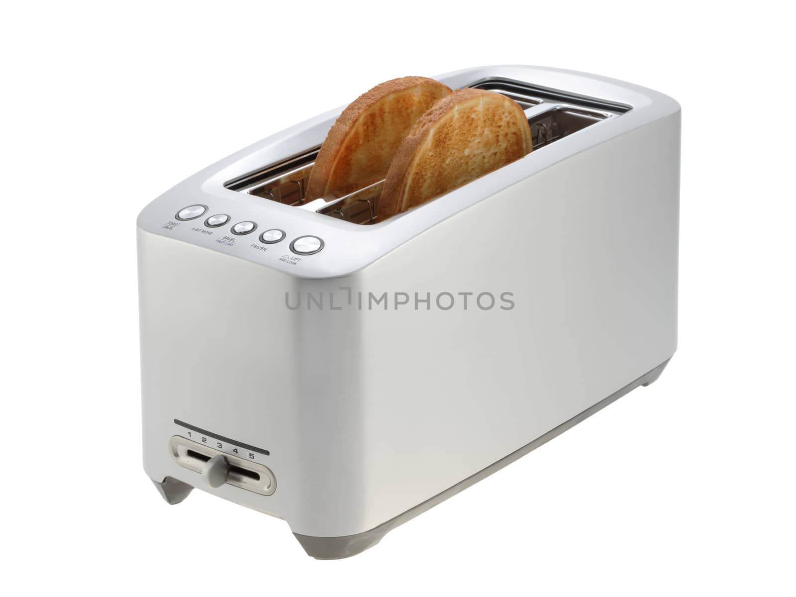 Slices of toast in a silver chrome toaster isolated in white with clipping path