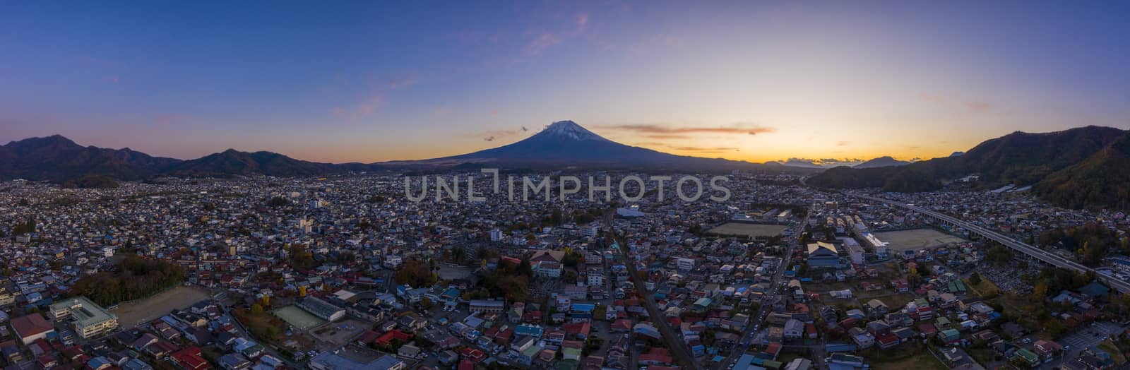 Aerial view panorama of mount Fuji in city at Fujiyoshida, Yamanashi, Japan. Fujisan on sanset.