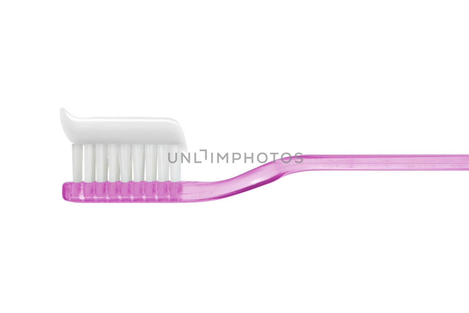 toothpaste on pink toothbrush isolated isolated on white with cl by VivacityImages