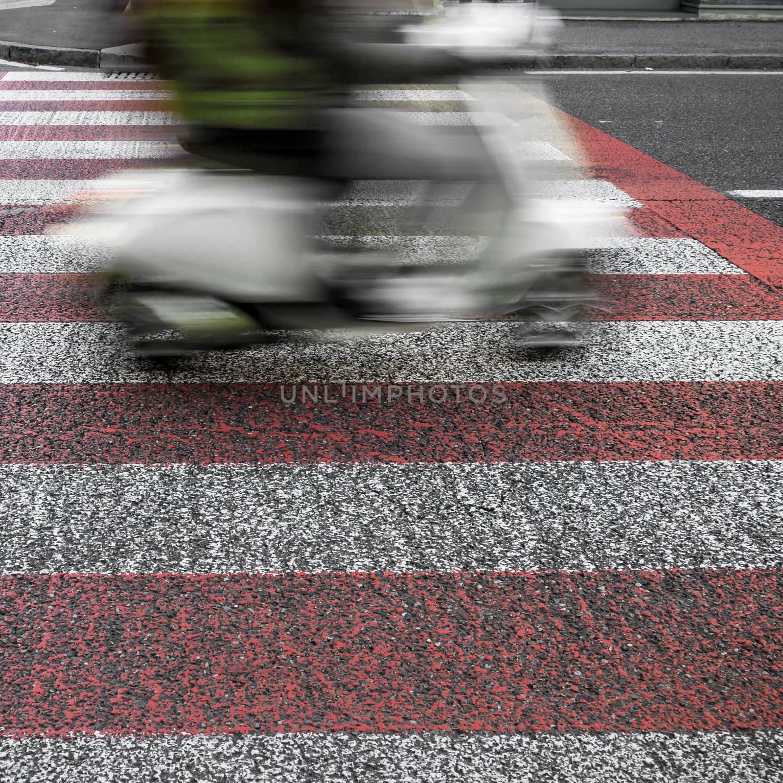 Scooter on a city street in motion blur