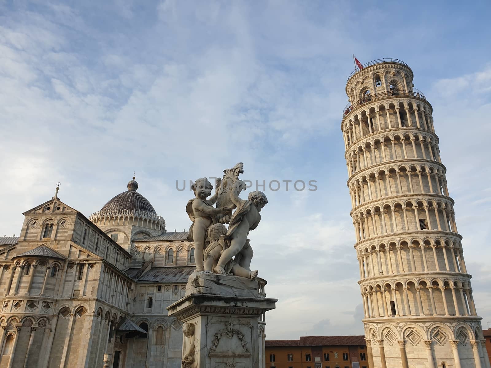 The leaning tower of Pisa and Piazza dei Miracoli in a sunny day - The Miracle Square, the Leaning Tower and the Cathedral is visited everyday by thousand of tourists - Pisa, Tuscany, Italy