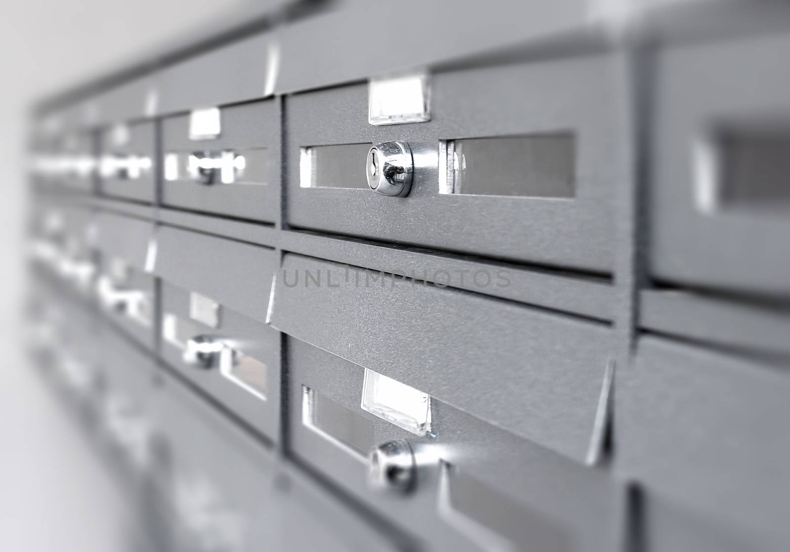 Aluminum mail boxes. Ideal for concepts such as safety and security, business communication and more. Shallow DOF.