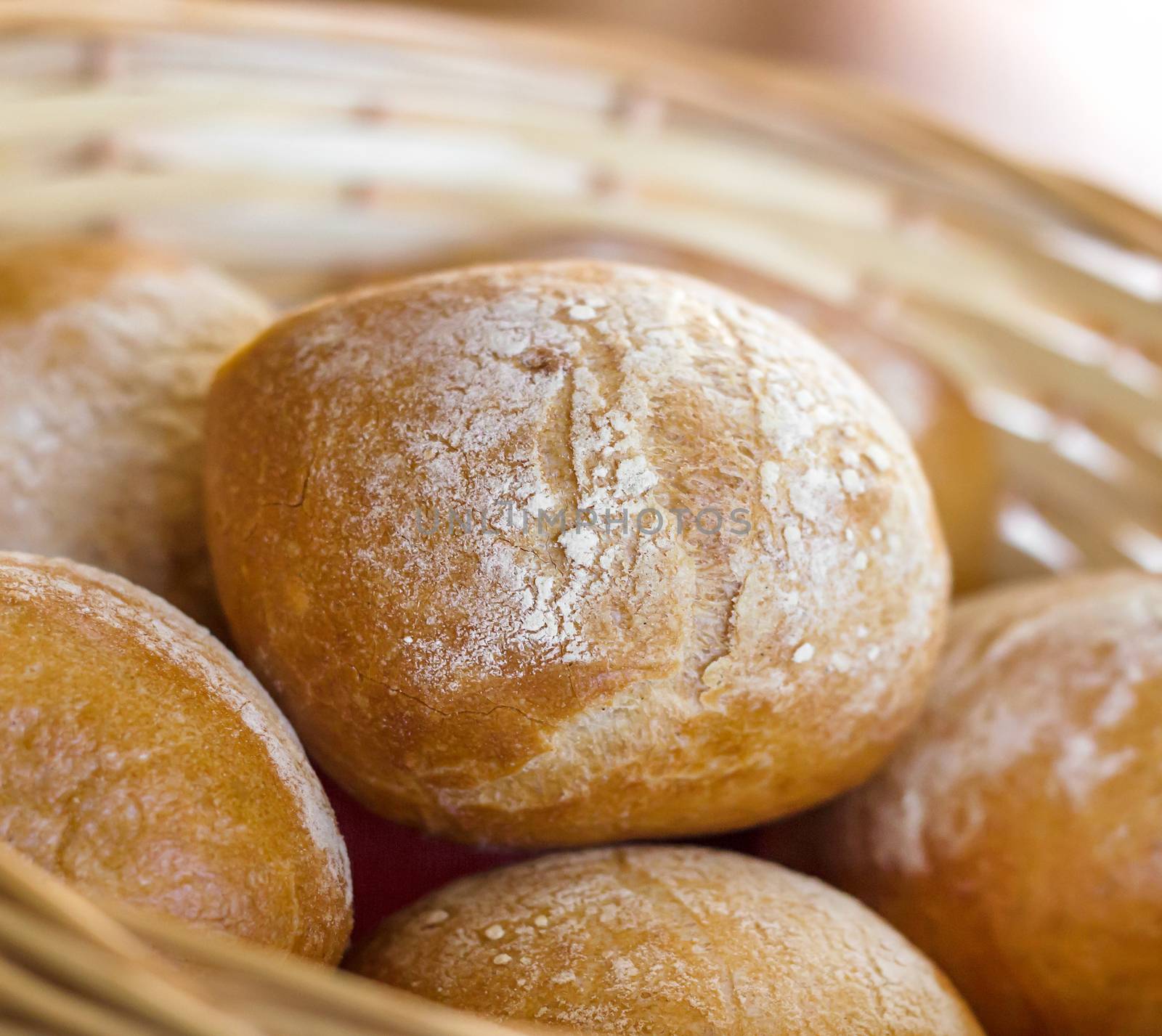 Bread and buns inside basket by germanopoli