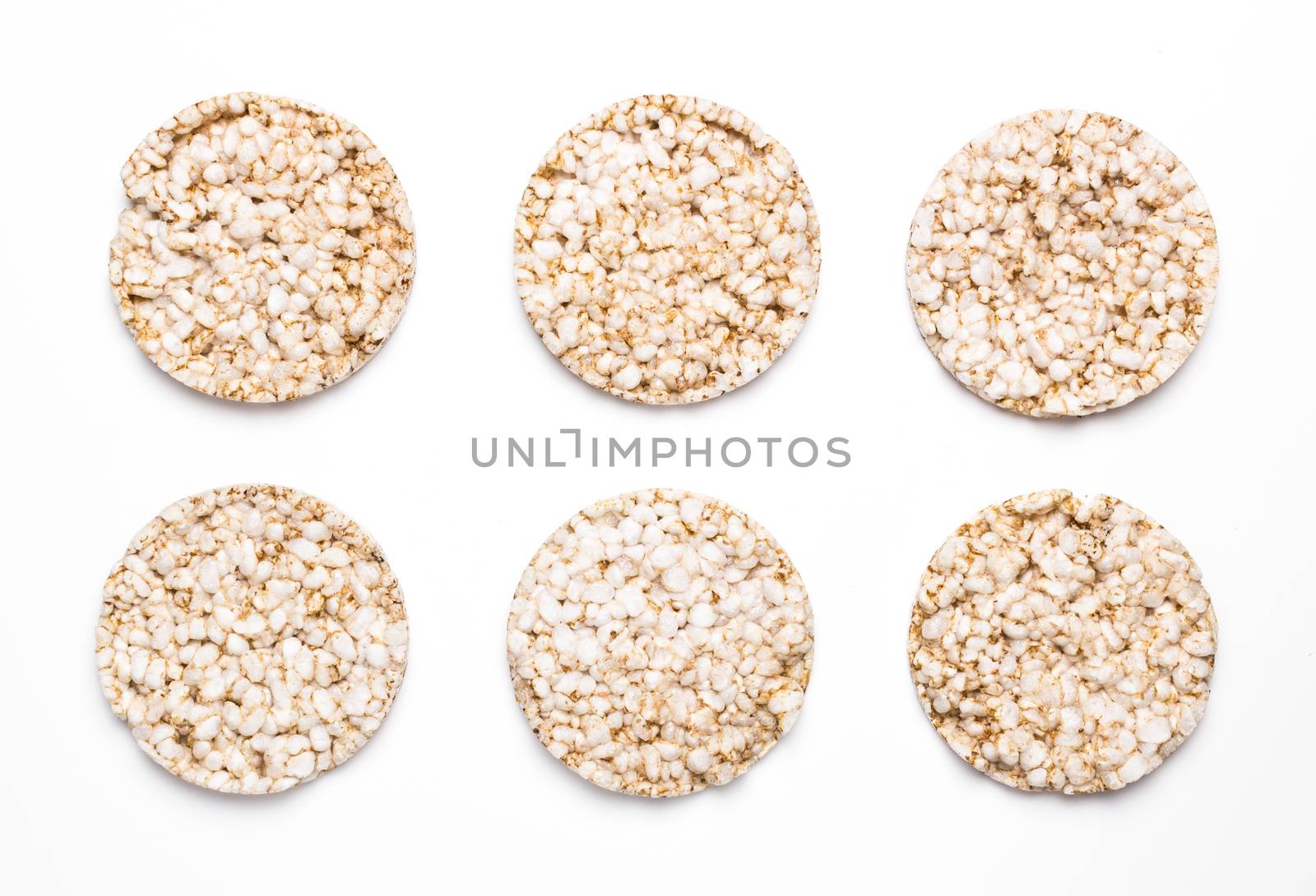 Six rice and spelled cakes isolated on white. Concept of healthy eating and diet.