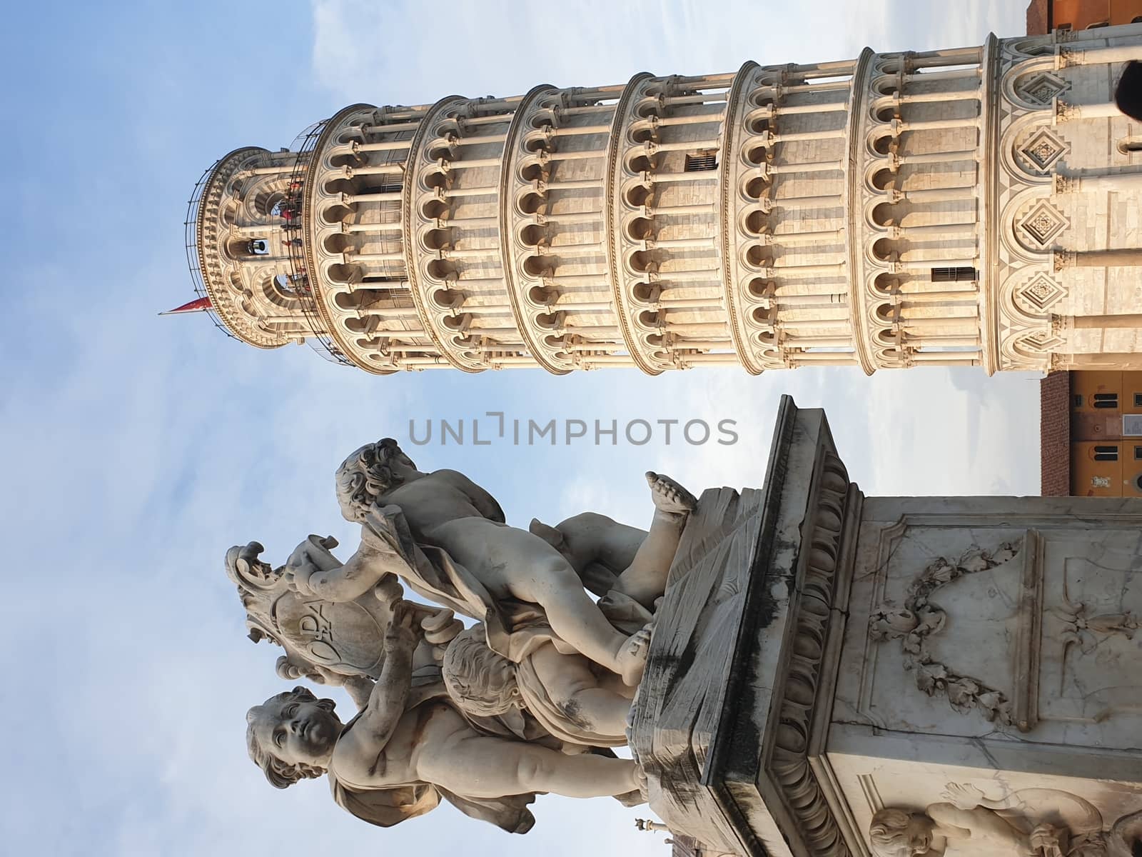 The leaning tower of Pisa and Piazza dei Miracoli in a sunny day - The Miracle Square, the Leaning Tower and the Cathedral is visited everyday by thousand of tourists - Pisa, Tuscany, Italy