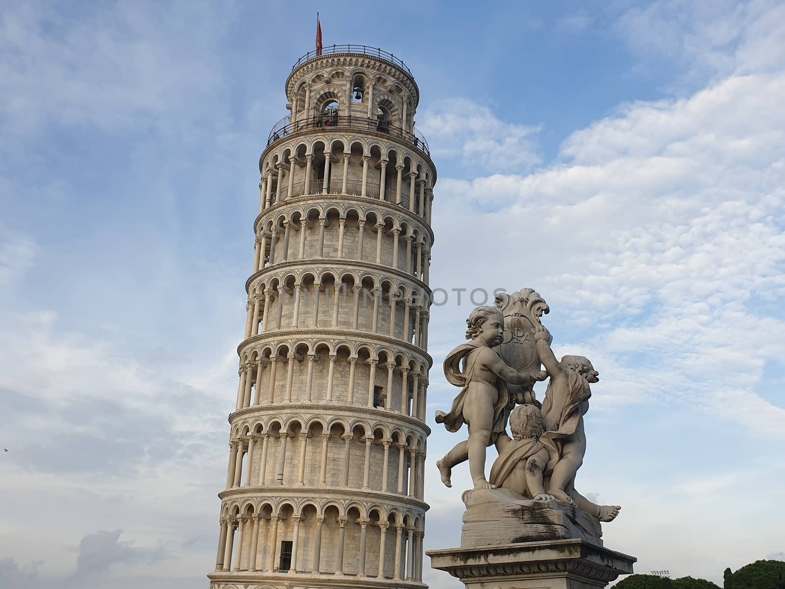 The leaning tower of Pisa and Piazza dei Miracoli in a sunny day - The Miracle Square, the Leaning Tower and the Cathedral is visited everyday by thousand of tourists - Pisa, Tuscany, Italy by matteobartolini