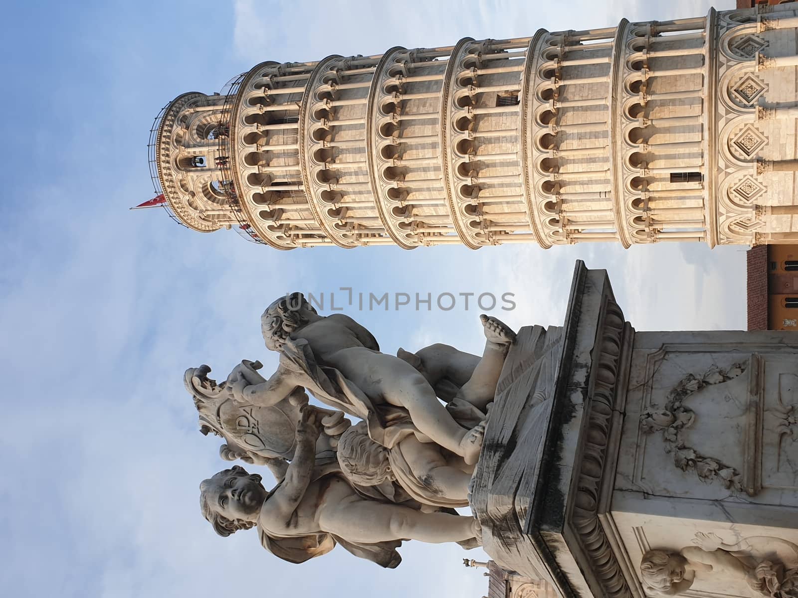 The leaning tower of Pisa and Piazza dei Miracoli in a sunny day - The Miracle Square, the Leaning Tower and the Cathedral is visited everyday by thousand of tourists - Pisa, Tuscany, Italy