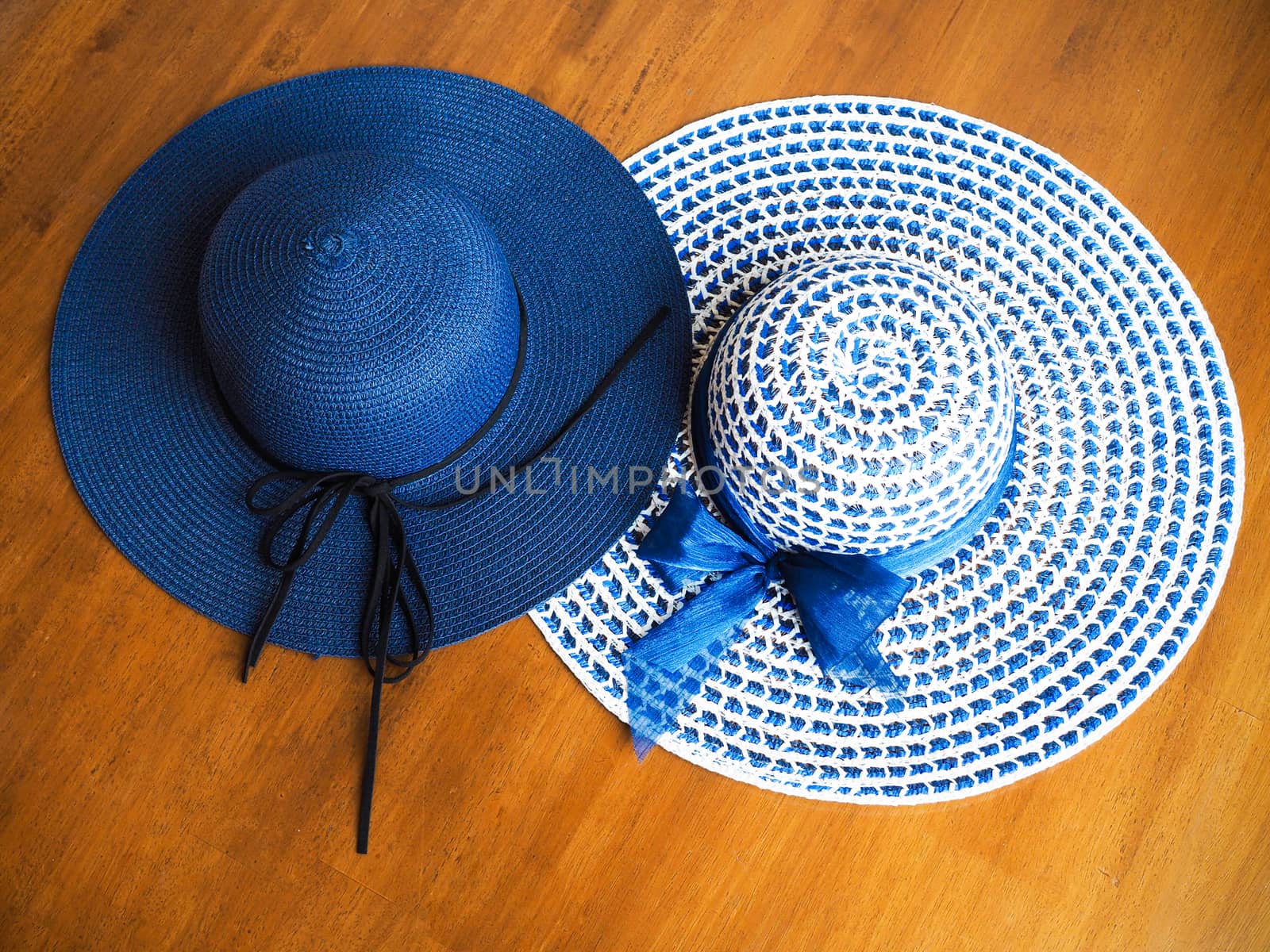 Top view of blue wide brimmed straw hat, summer fashion of women by kittima05