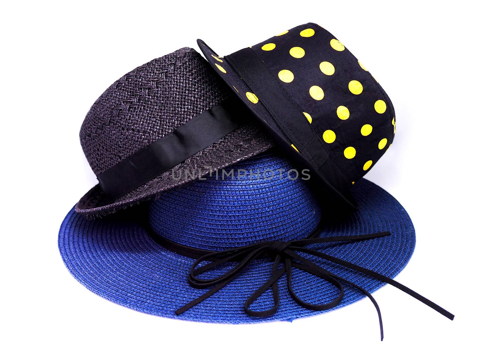Three fashion hats stacked. Women's blue hat and 2 black men's hats. Hat style vintage on white background.