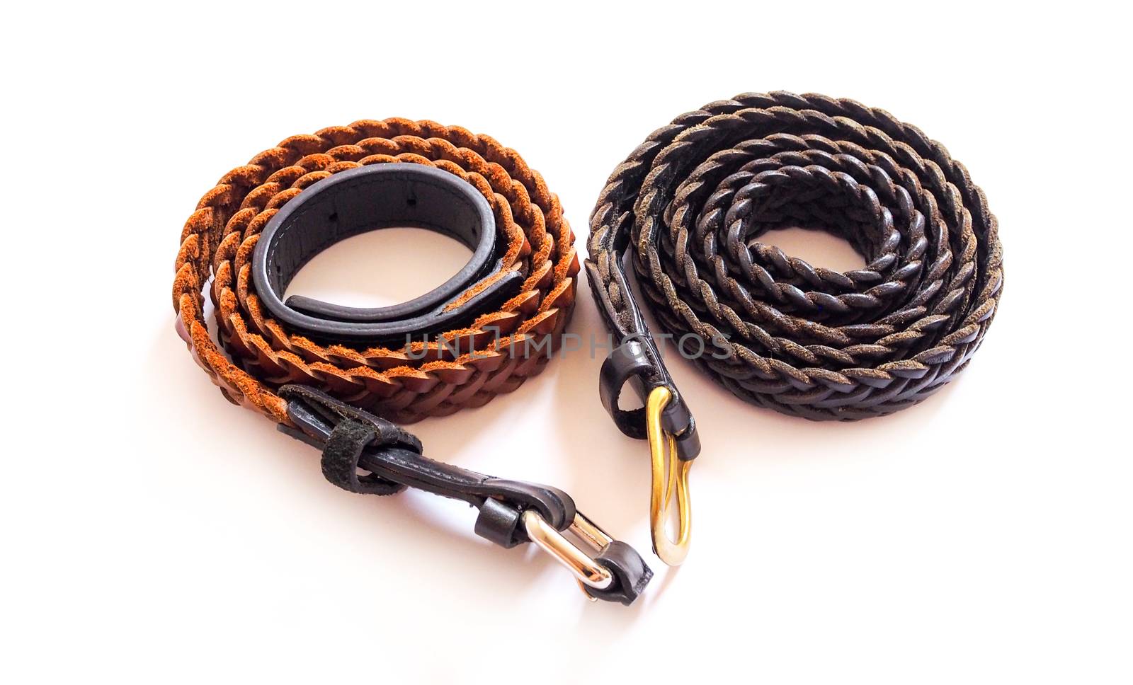 Two brown braided belts. Isolated on white background.