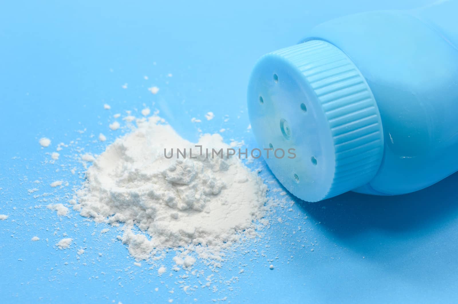 Baby talcum powder container on blue background