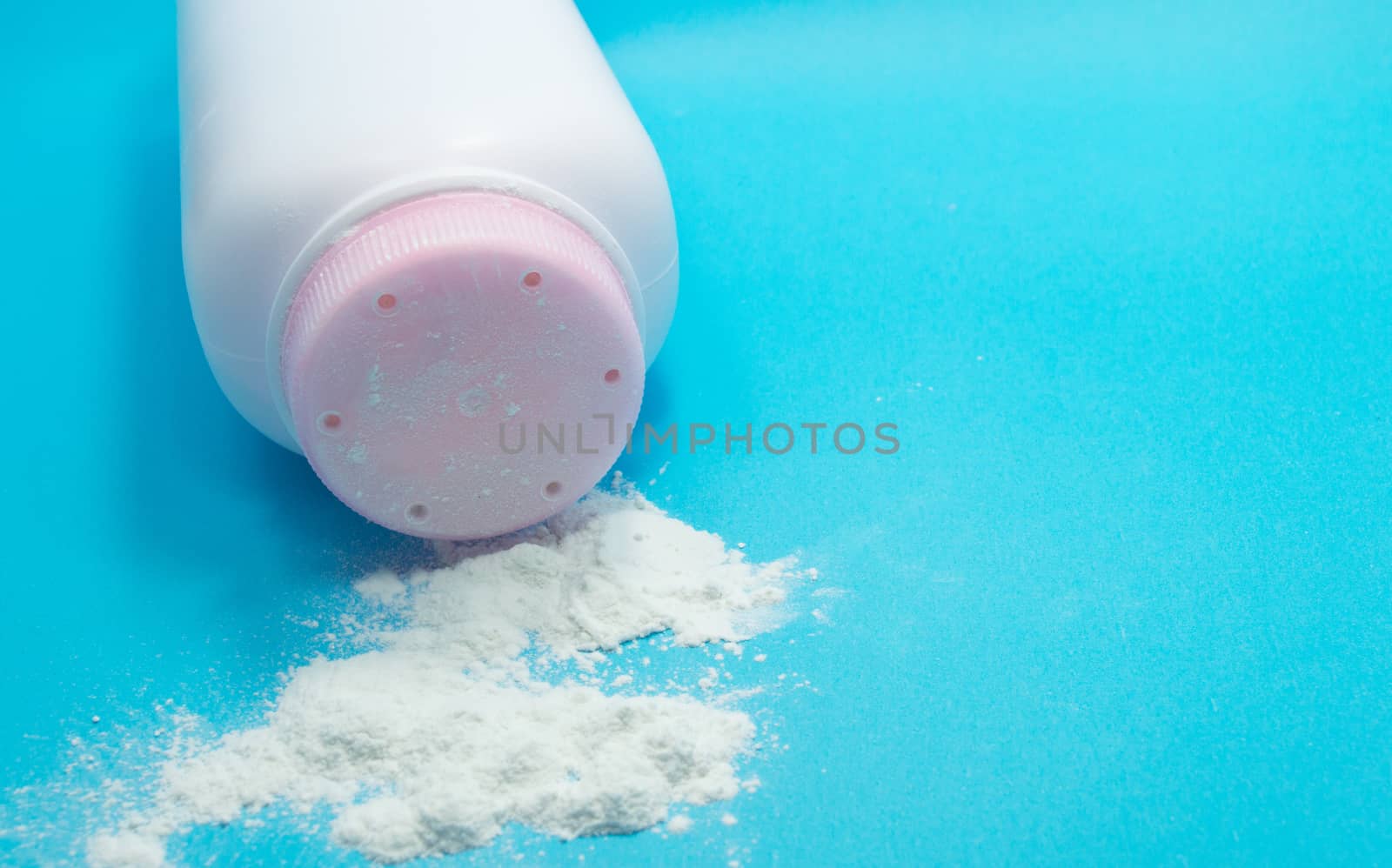 Baby talcum powder container on blue background