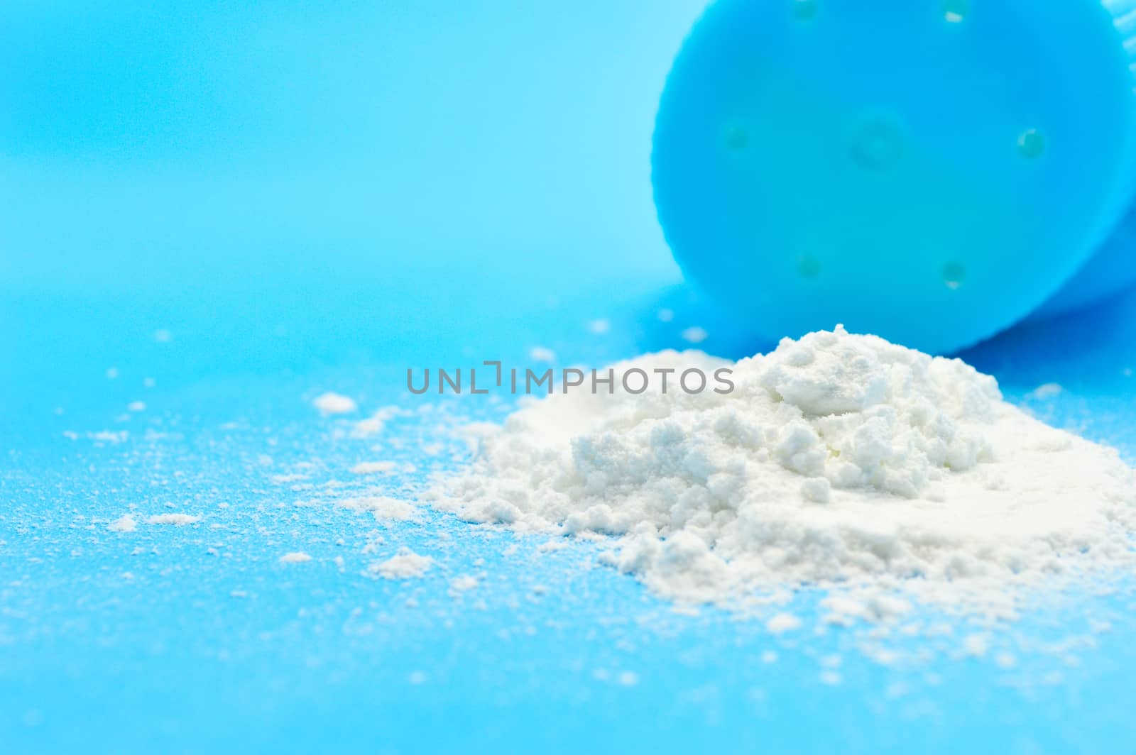 Baby talcum powder container on blue background