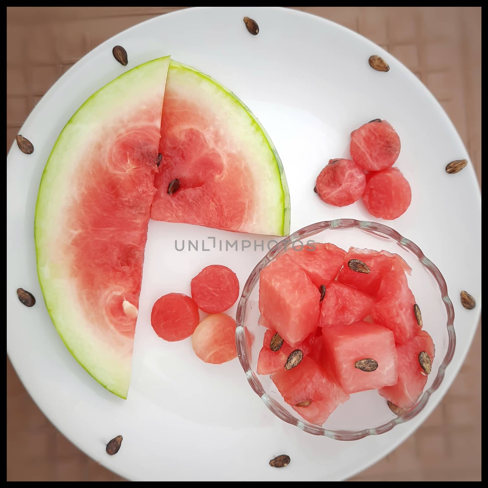 Chill pink color slices of watermelon with round shape cut pieces in white plate and good drink for summer days and healthy fruit and also to keep body hydrate drink