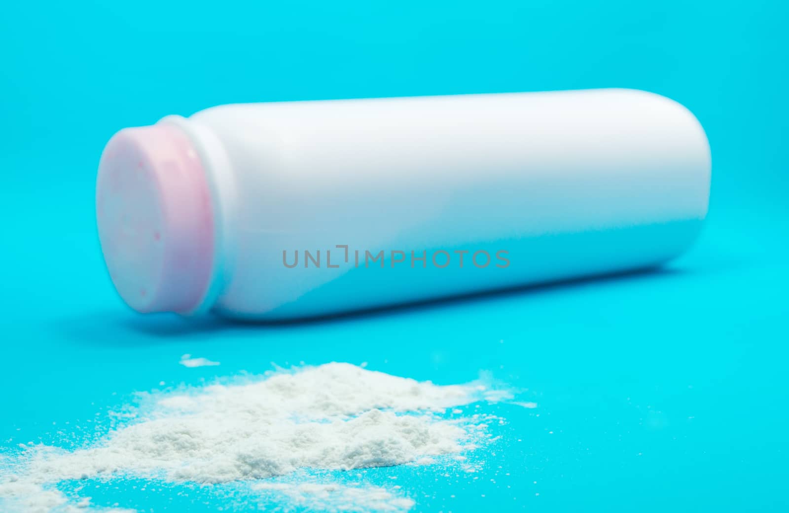 Baby talcum powder container on blue background