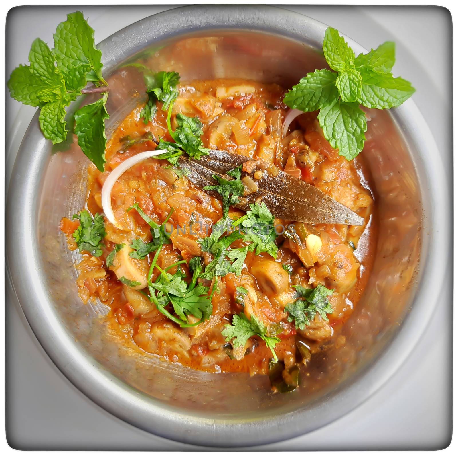 Colorful Delicious yummy indian spicy mushroom gravy in white bowl and it's one of favorite restaurant cuisine food