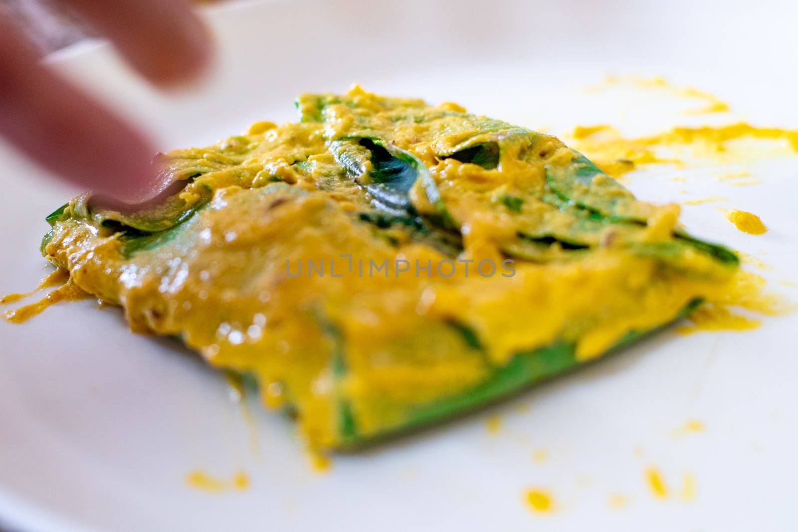 Beautiful Arvi colocasia root leaves coated with flour gram and turmeric paste and wrapped and tied ready for frying. This is a popular dish in North india especially in cities like Mumbai, Delhi and other to make pakode bhajiya and more