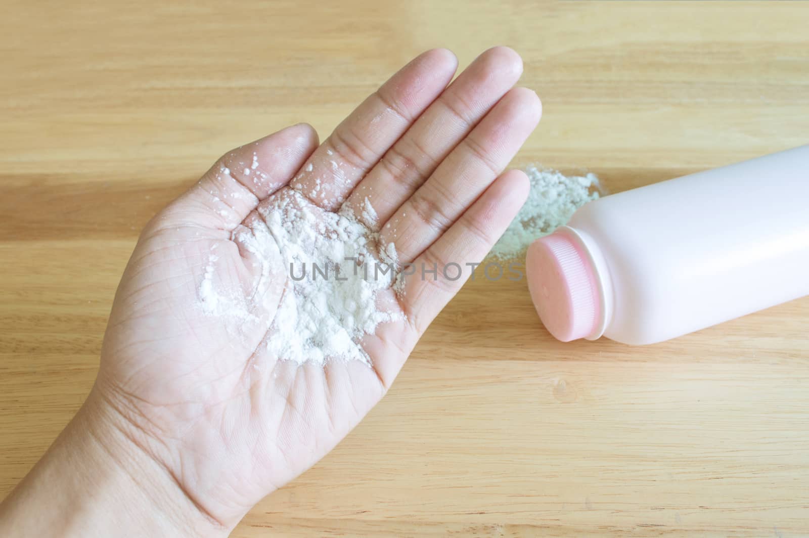 Baby talcum powder container on blue background