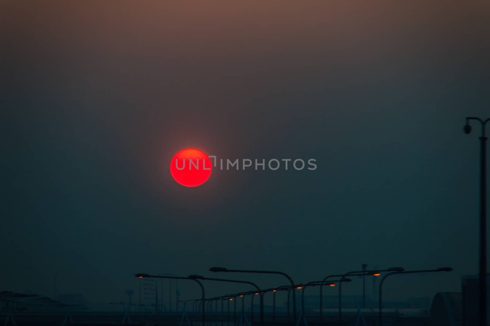 Beautiful Nature Egg Yolk Sunrise with colourful sky environment. Sun egg yolk, beautiful calm sky with orange sunrise in the morning at the airport. Morning sun egg yolk with silhouette background.