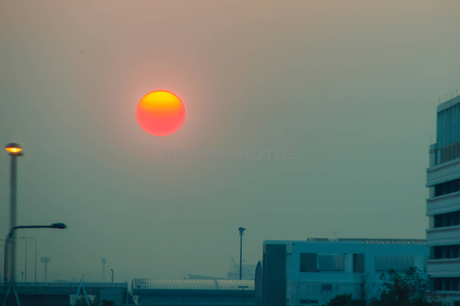 Beautiful Nature Egg Yolk Sunrise with colourful sky environment. Sun egg yolk, beautiful calm sky with orange sunrise in the morning at the airport. Morning sun egg yolk with silhouette background.