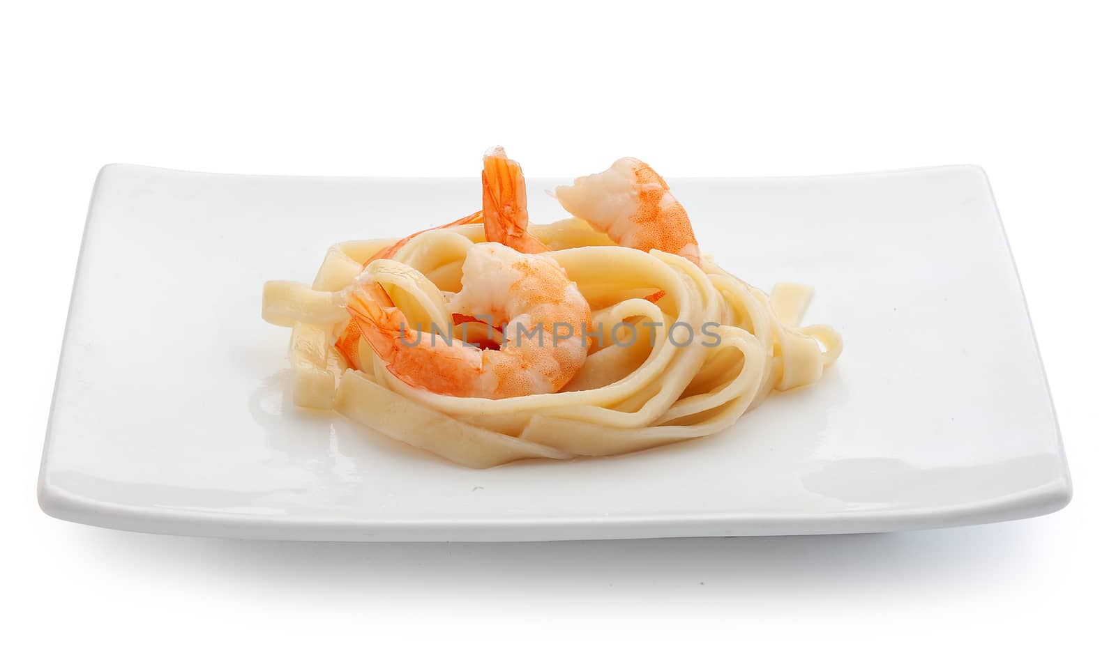 Boiled shrimps with pasta on the plate