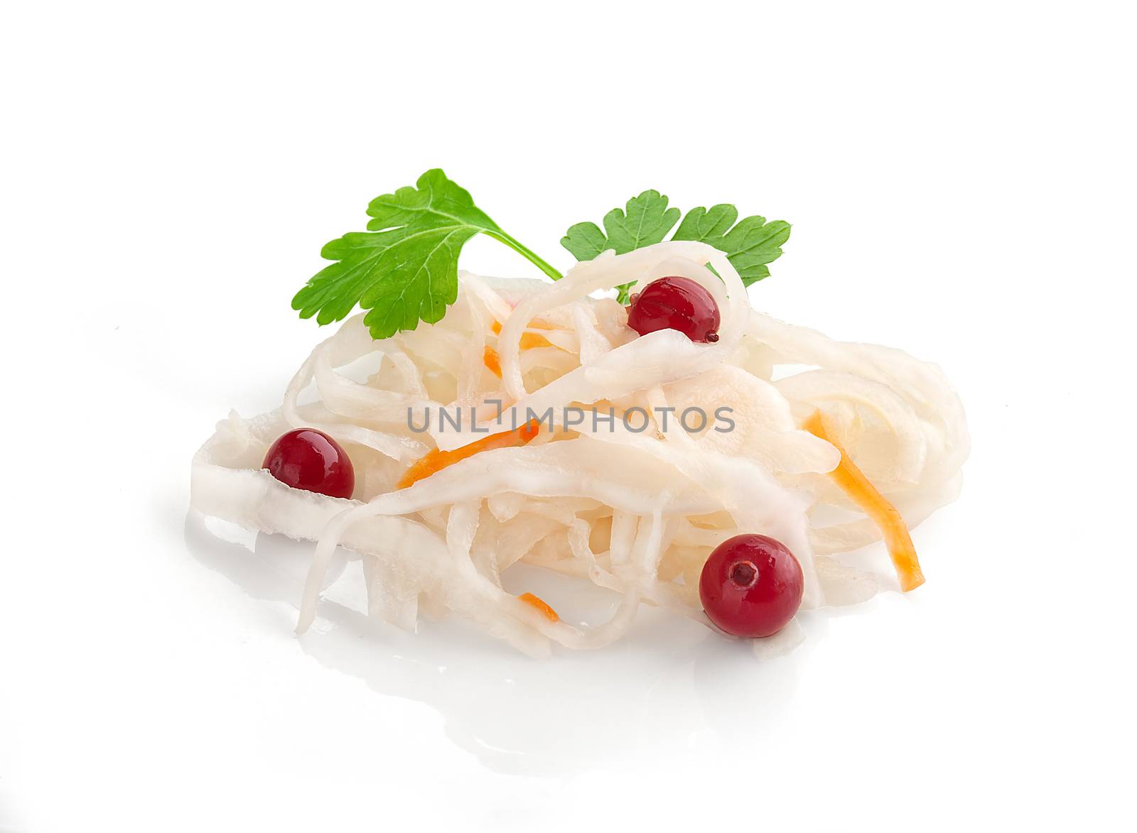 Isoalted handful of sauerkraut with red cranberry and fresh green parsley