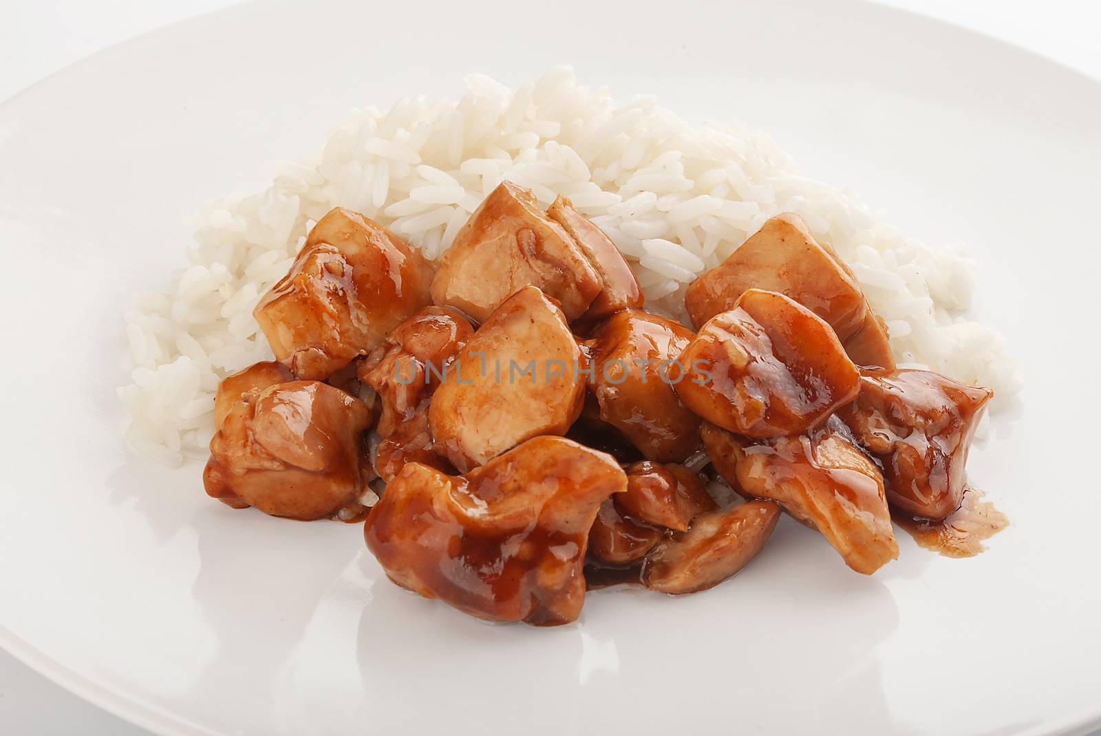 Fried teriyaki with rice on the white plate