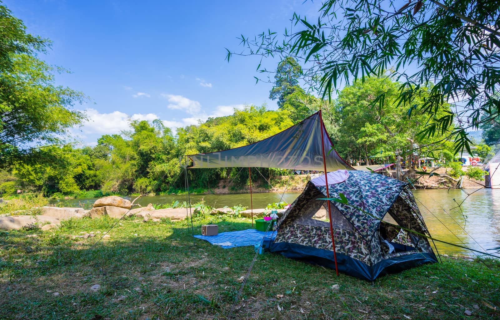Camping and tent in nature park near the river