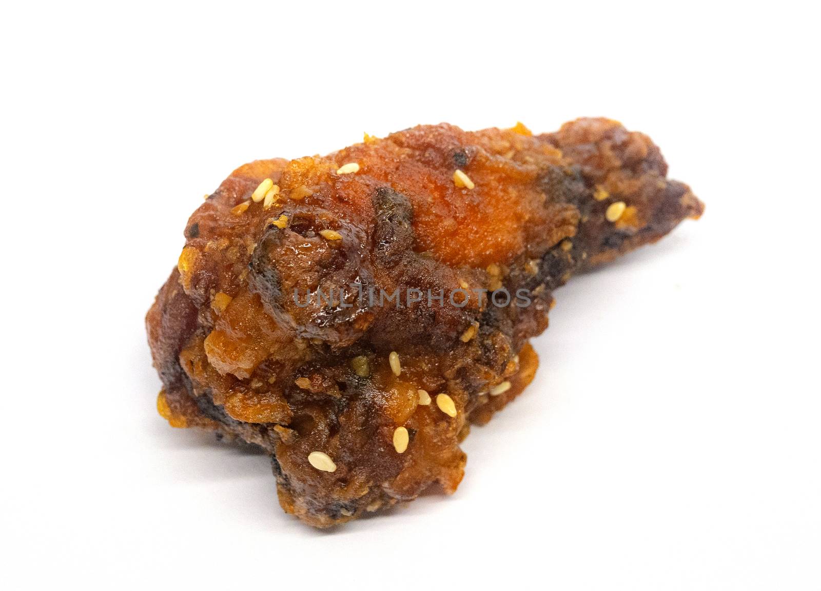 Korean style fried chicken in spicy and sour sauce. Isolated by Nu1983