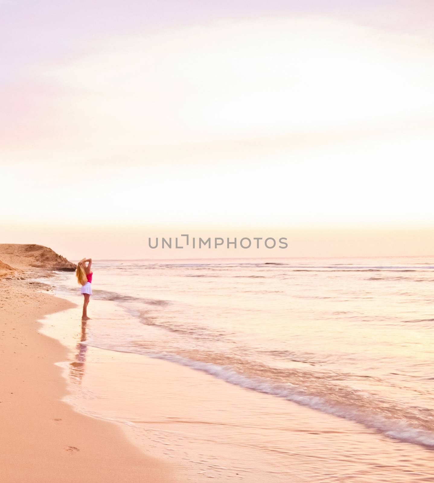 Girl and the sea at sunrise, travel and beach lifestyle by Anneleven