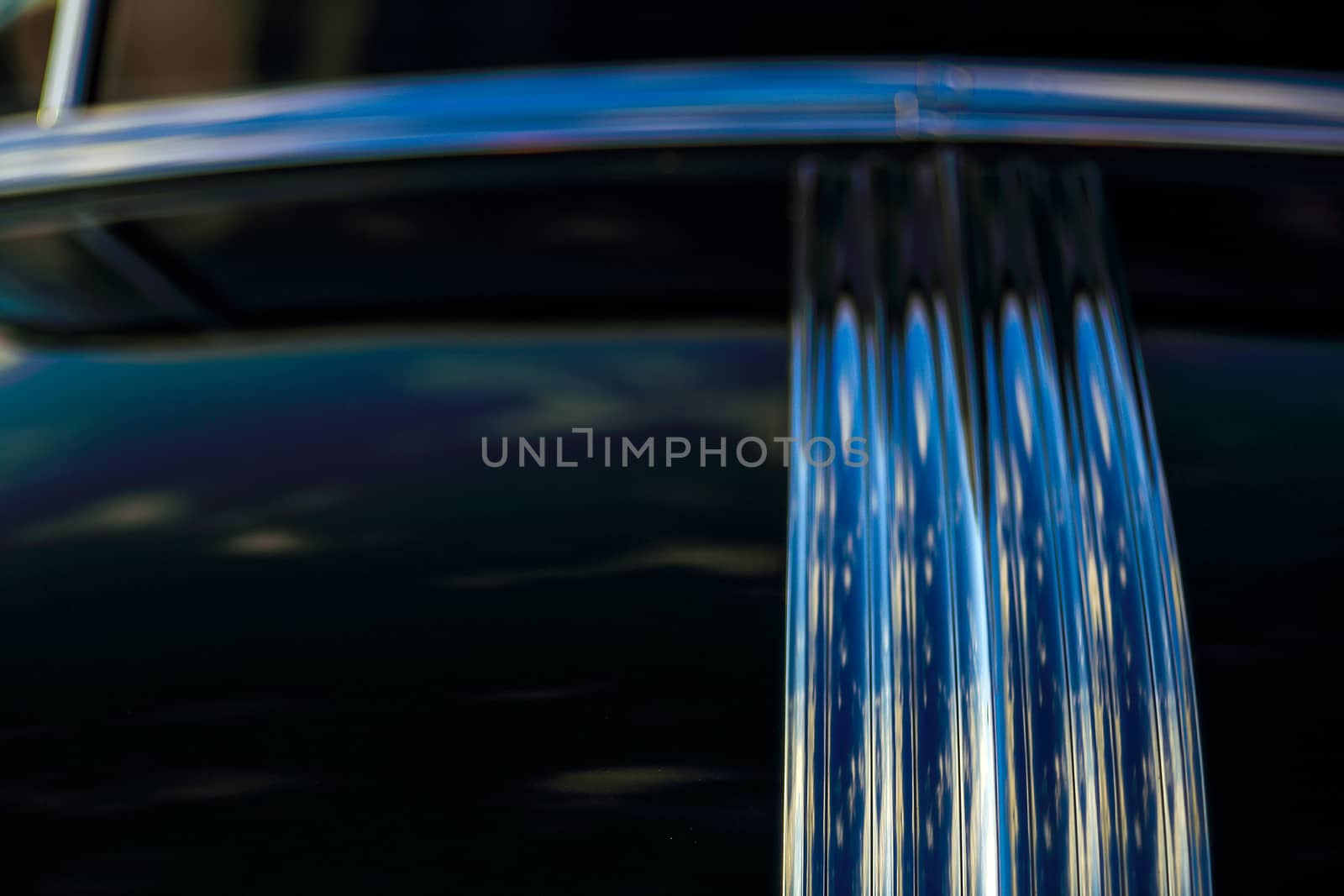 Abstract background with bokeh defocused classic car. Colorful abstract background retro car. Boke background with copy space. Close-up view vintage auto details with bubble bokeh effect.